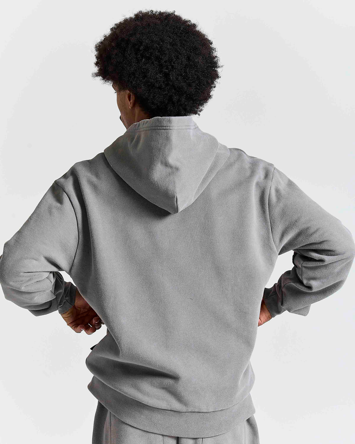 Displays a model wearing the Grey 'Hoodrich' branded men's Inkfall Full Tracksuit