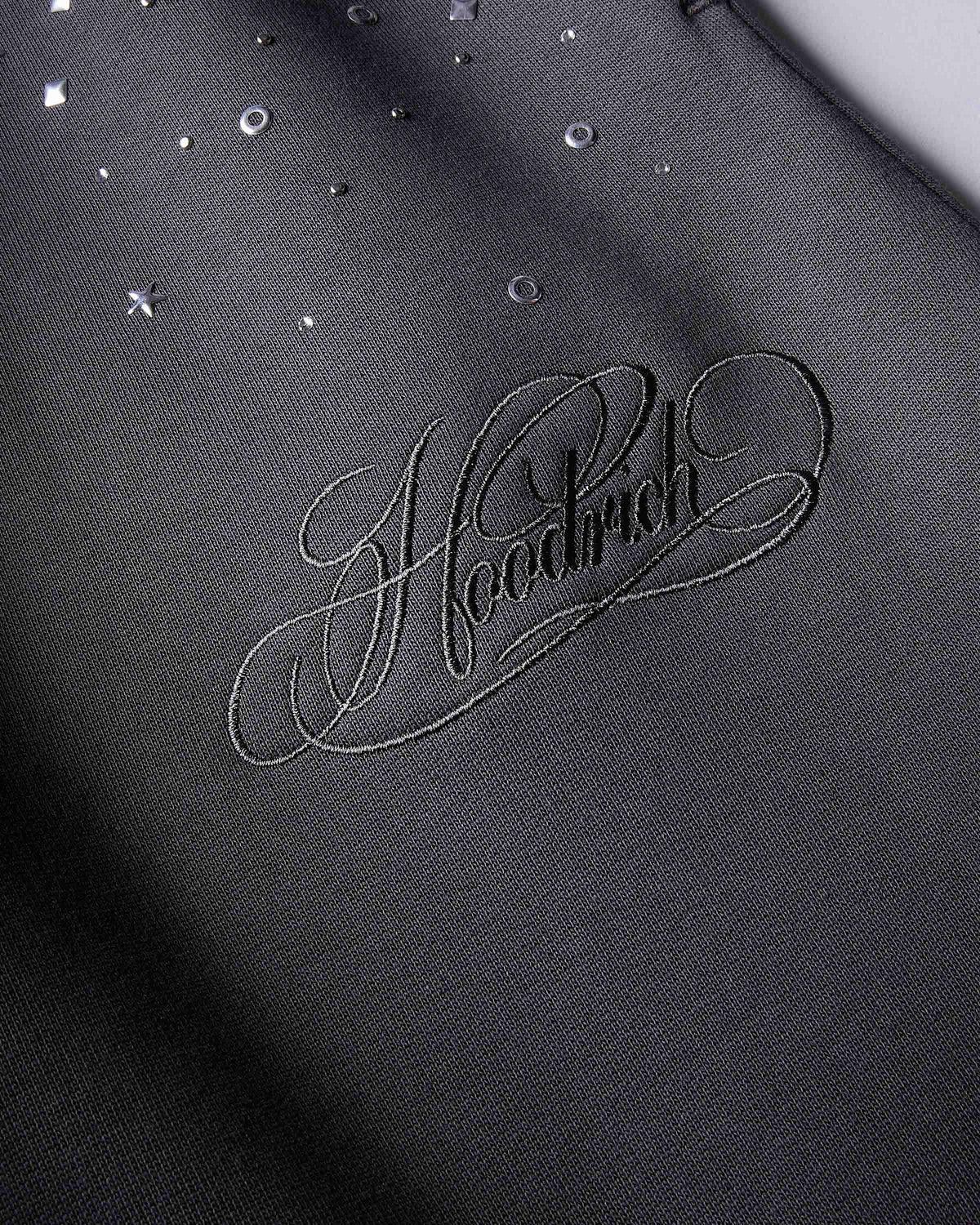 Displays the silver 'hoodrich' branded Clash V2 Oversized Wide Leg Joggers featuring the hoodrich branding details