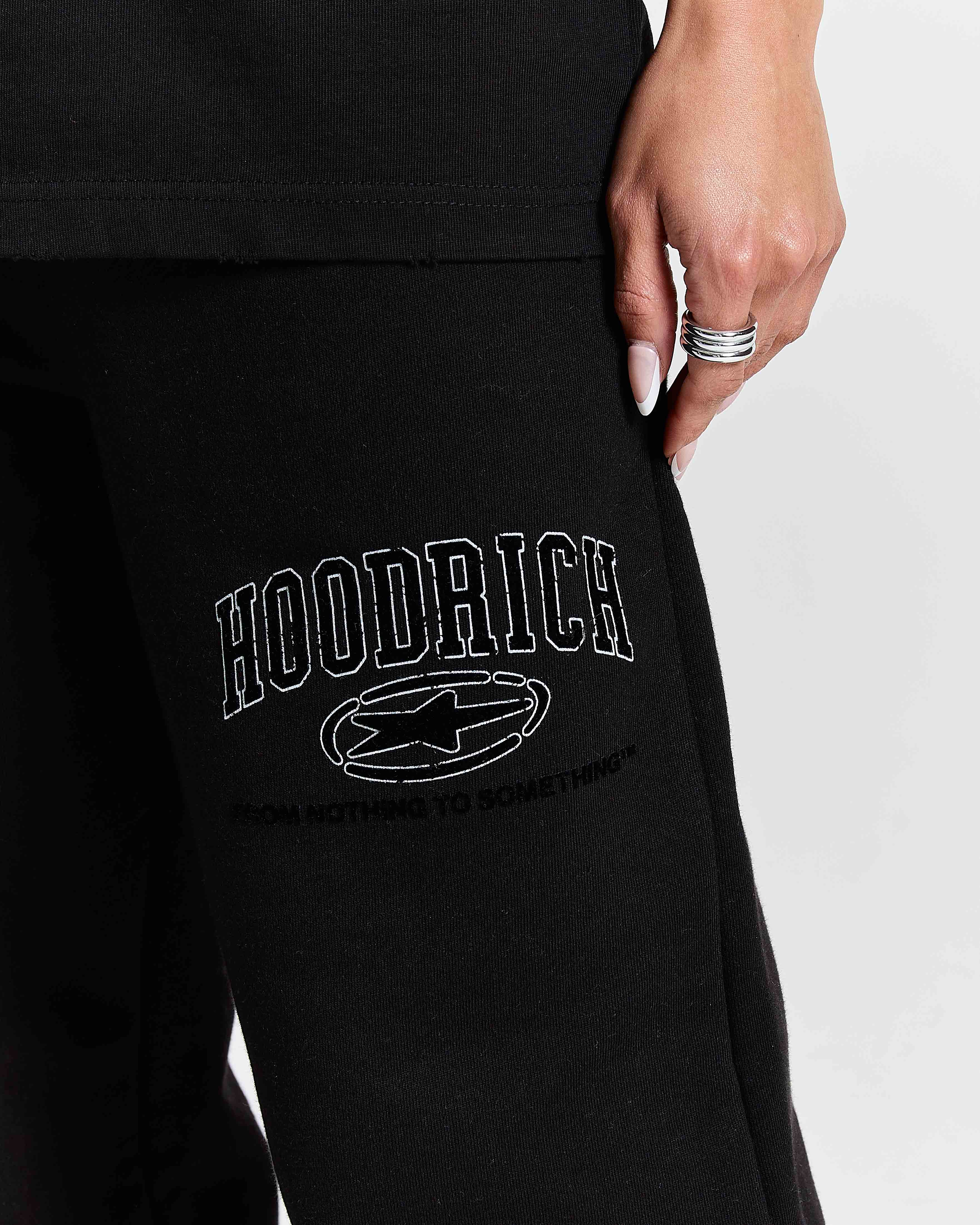 Black hoodie with 'Hoodrich' logo on a plain background