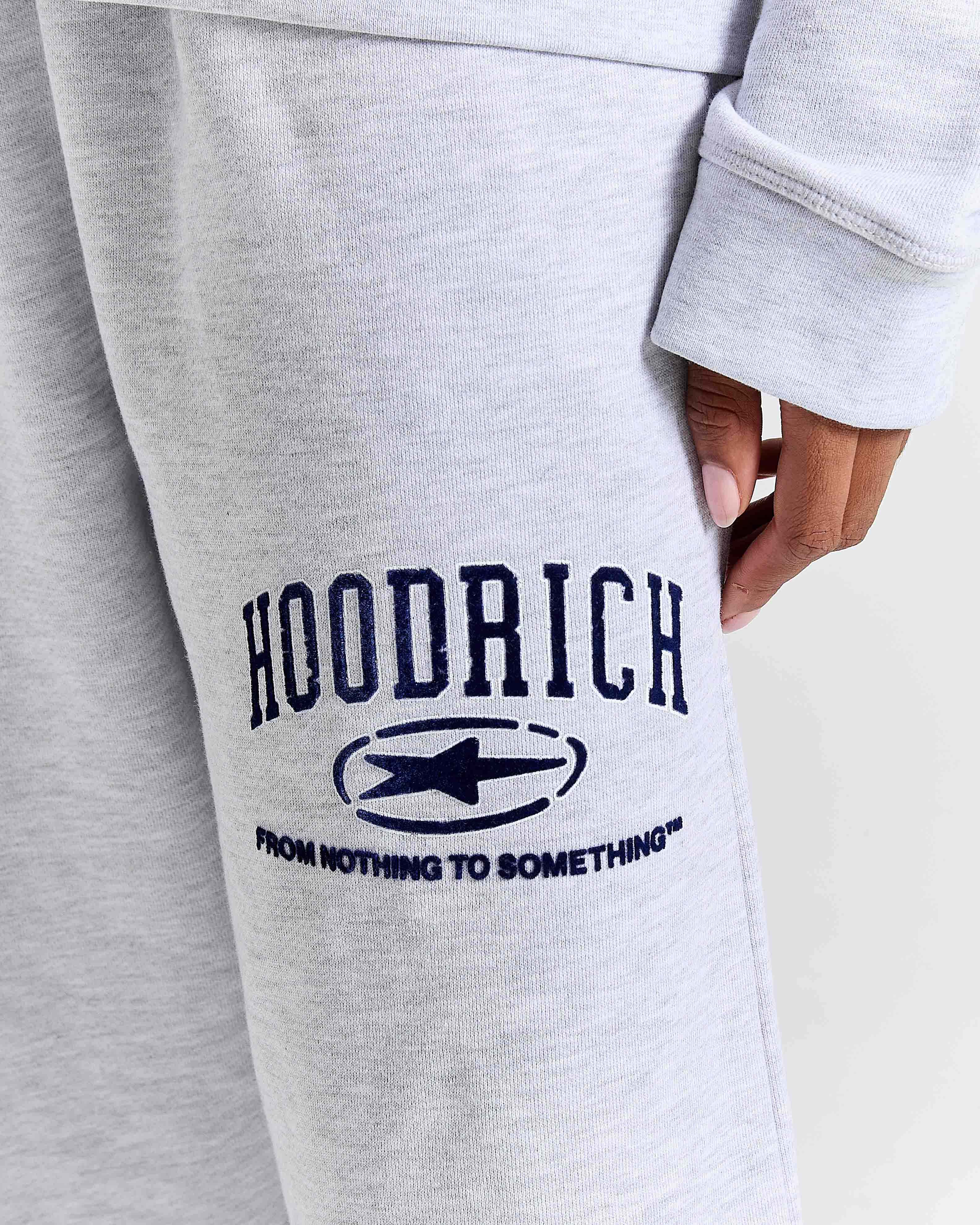 Displays a model wearing the Grey 'Hoodrich' branded Women's Frey Full Tracksuit