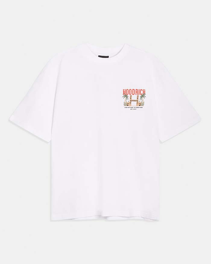 A white short-sleeve crewneck t-shirt with a small multicolor graphic on the left chest featuring the brand name 'HOODRICH' and a palm tree illustration, displayed on a light gray background.