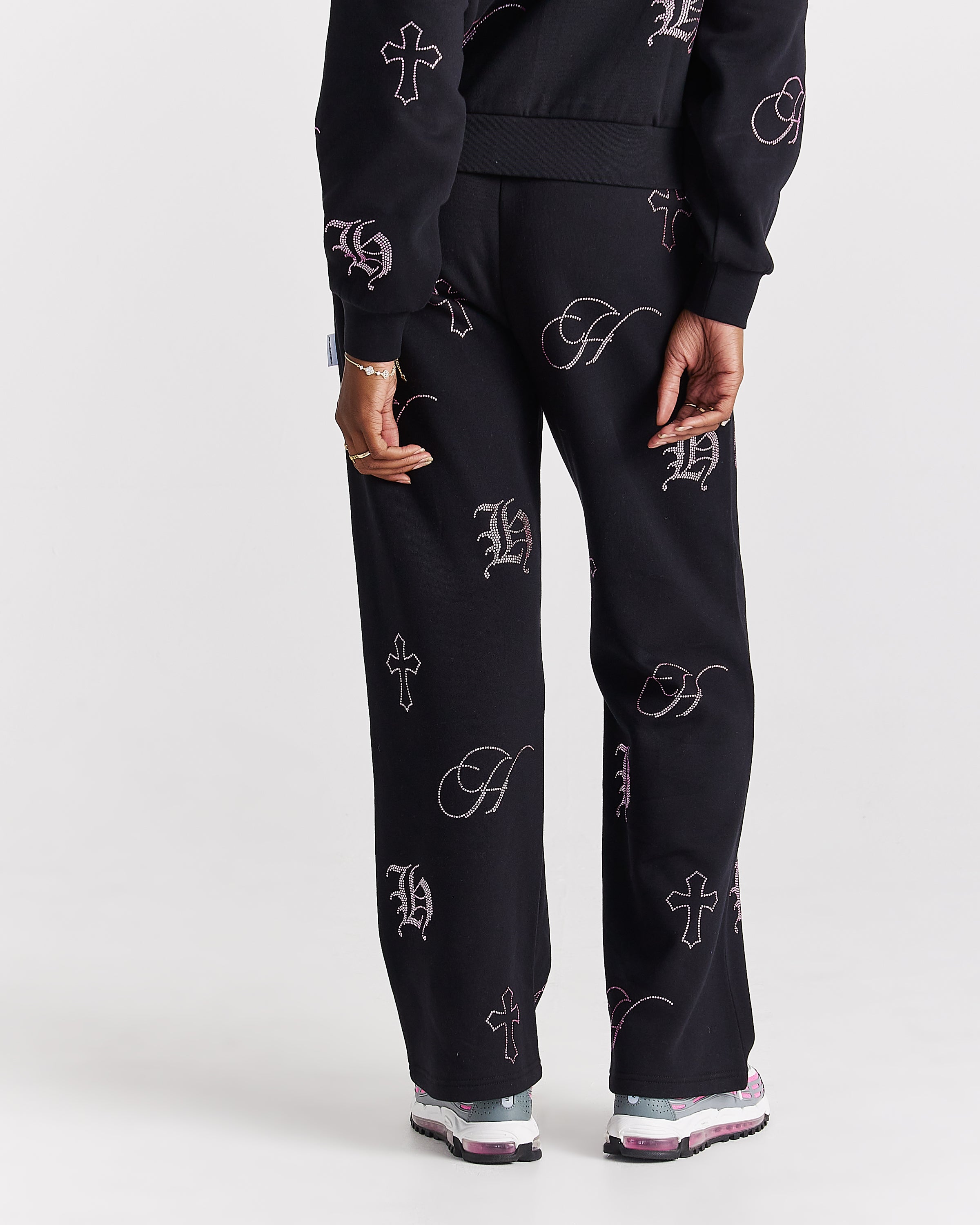 Pantaloni da jogging a gamba larga con cristalli - Nero/Strass rosa