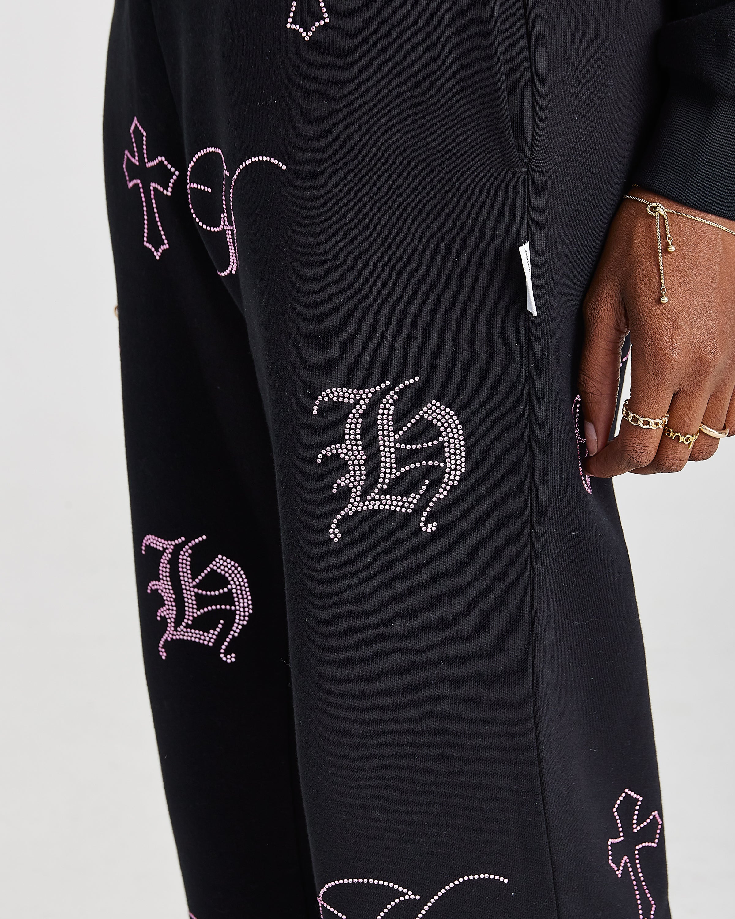 Pantaloni da jogging a gamba larga con cristalli - Nero/Strass rosa