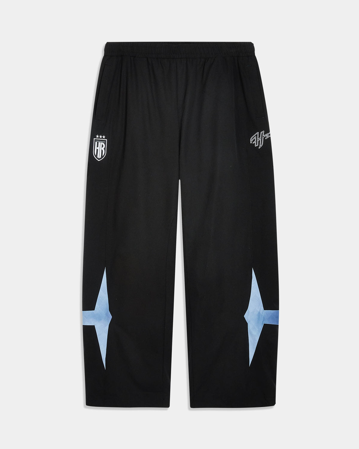 Black athletic sweatpants with white printed graphics on the upper thighs and light blue starburst shapes on the lower legs, shown flat against a light gray background.