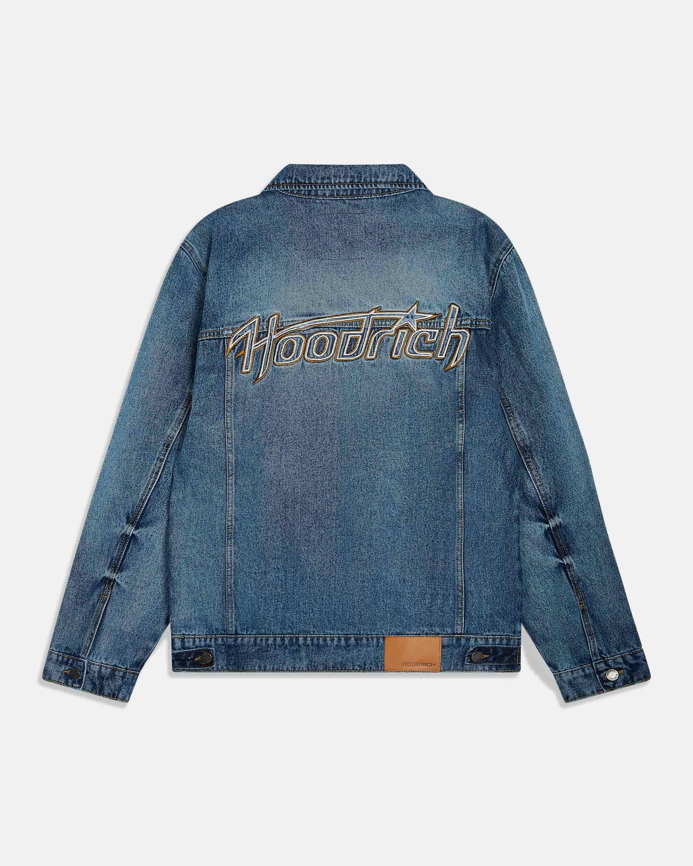 A blue denim jacket shown from the back, featuring a large embroidered 'Hoodrich' logo across the upper back in gold and white, set against a light gray background.