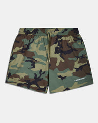 A pair of camouflage print athletic shorts with a green, brown, and black camo pattern, featuring a drawstring waist and a white 'HOODRICH' logo on the lower left leg, displayed against a light gray background.