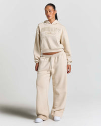 Displays a model wearing the Stone 'Hoodrich' branded women's Aegis Full Tracksuit 