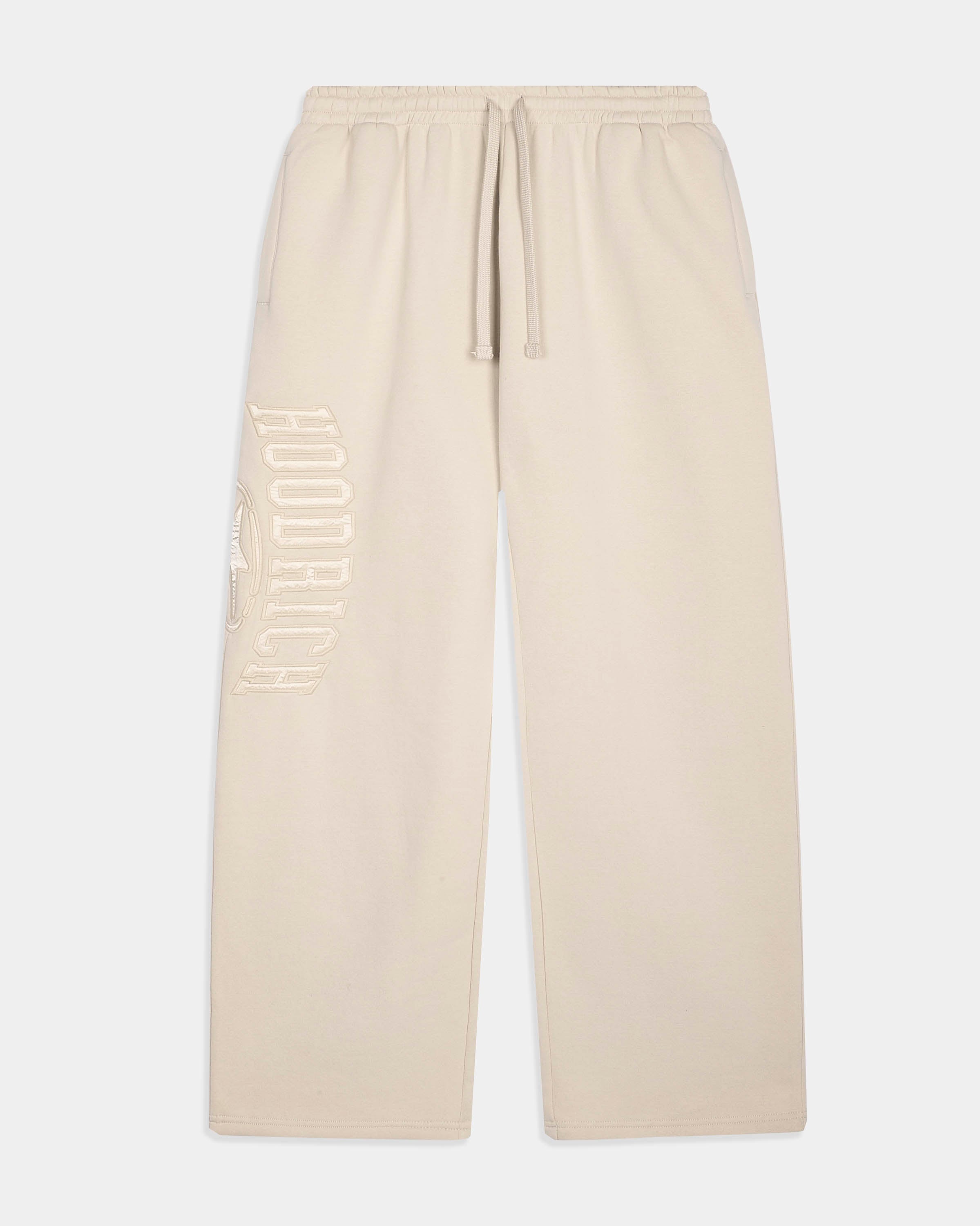 Cream-colored sweatpants with a drawstring waist and a tonal vertical 'HOODRICH' logo printed on the left leg, shown against a light gray background.