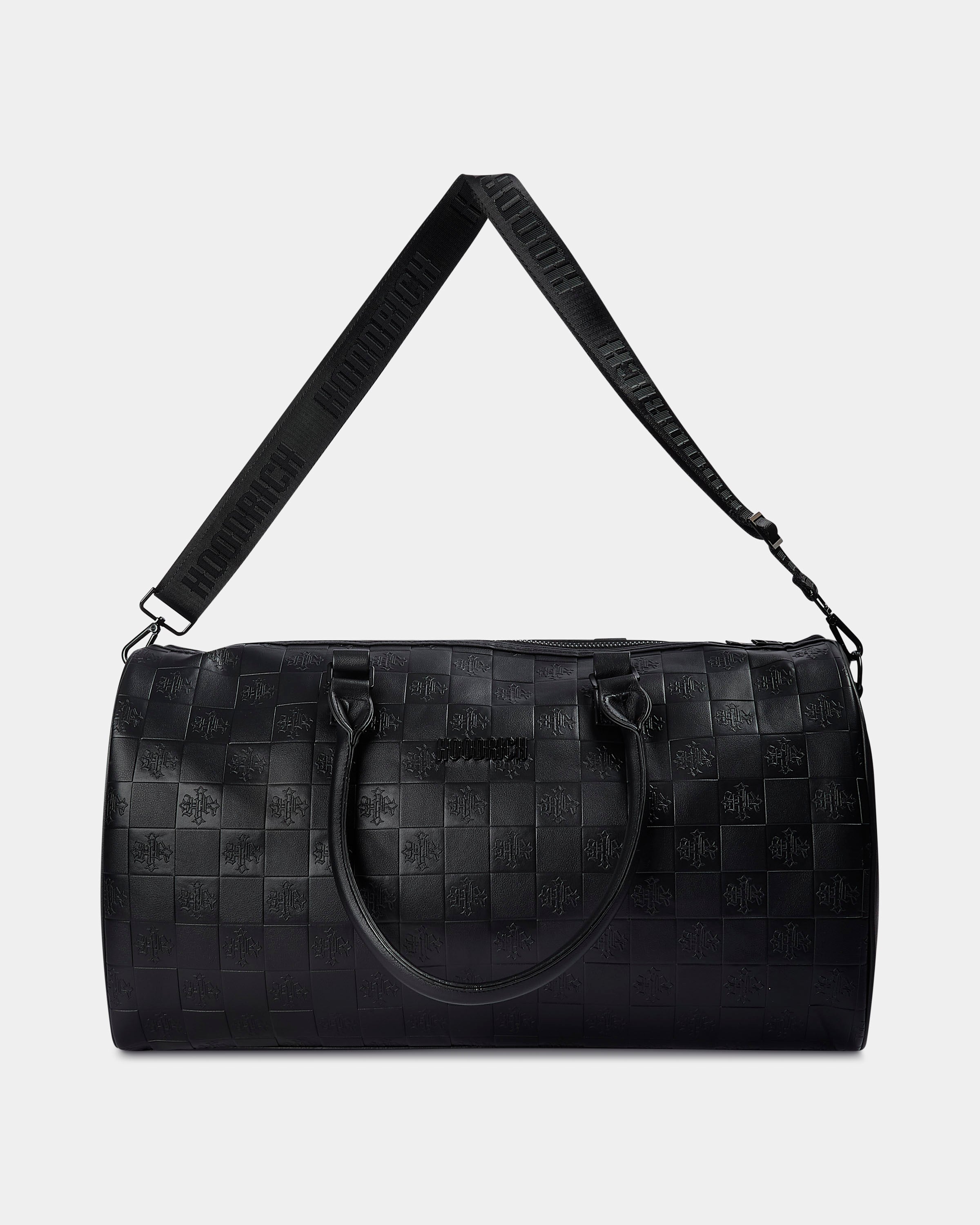Black woven duffel bag with a strap on a light gray background