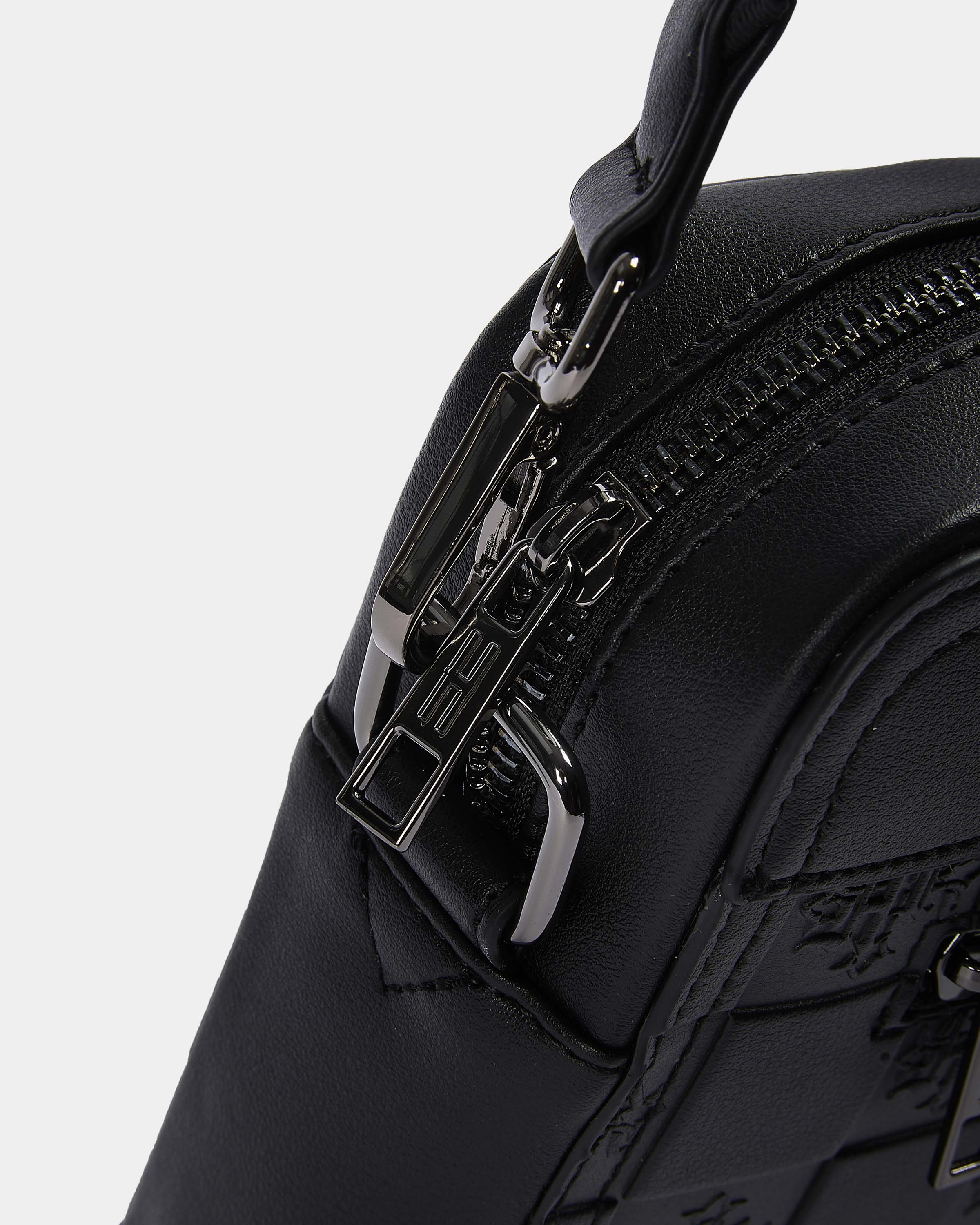 Black backpack with a prominent zipper and brand logo on a light gray background
