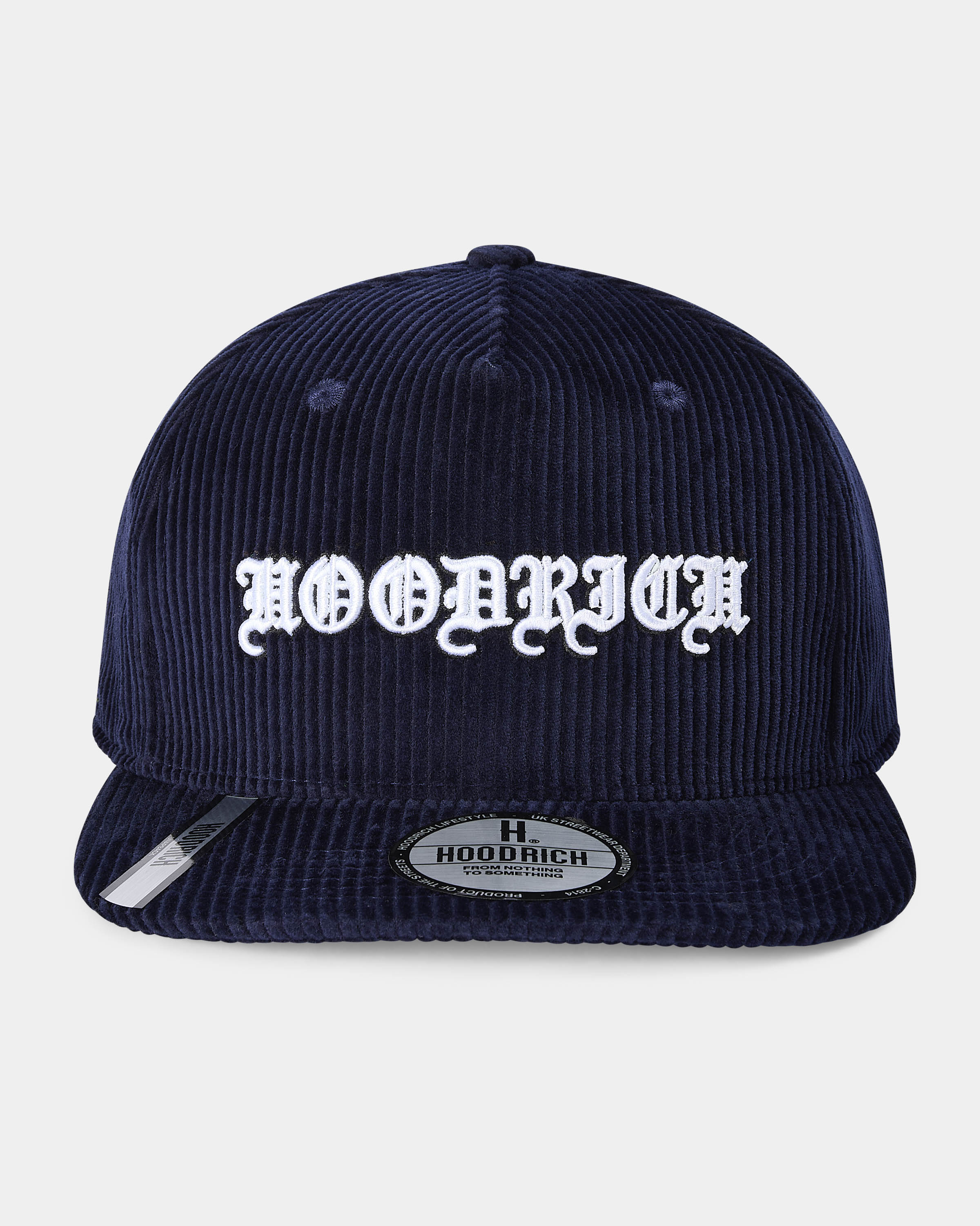 Navy blue corduroy cap with white text on a light gray background