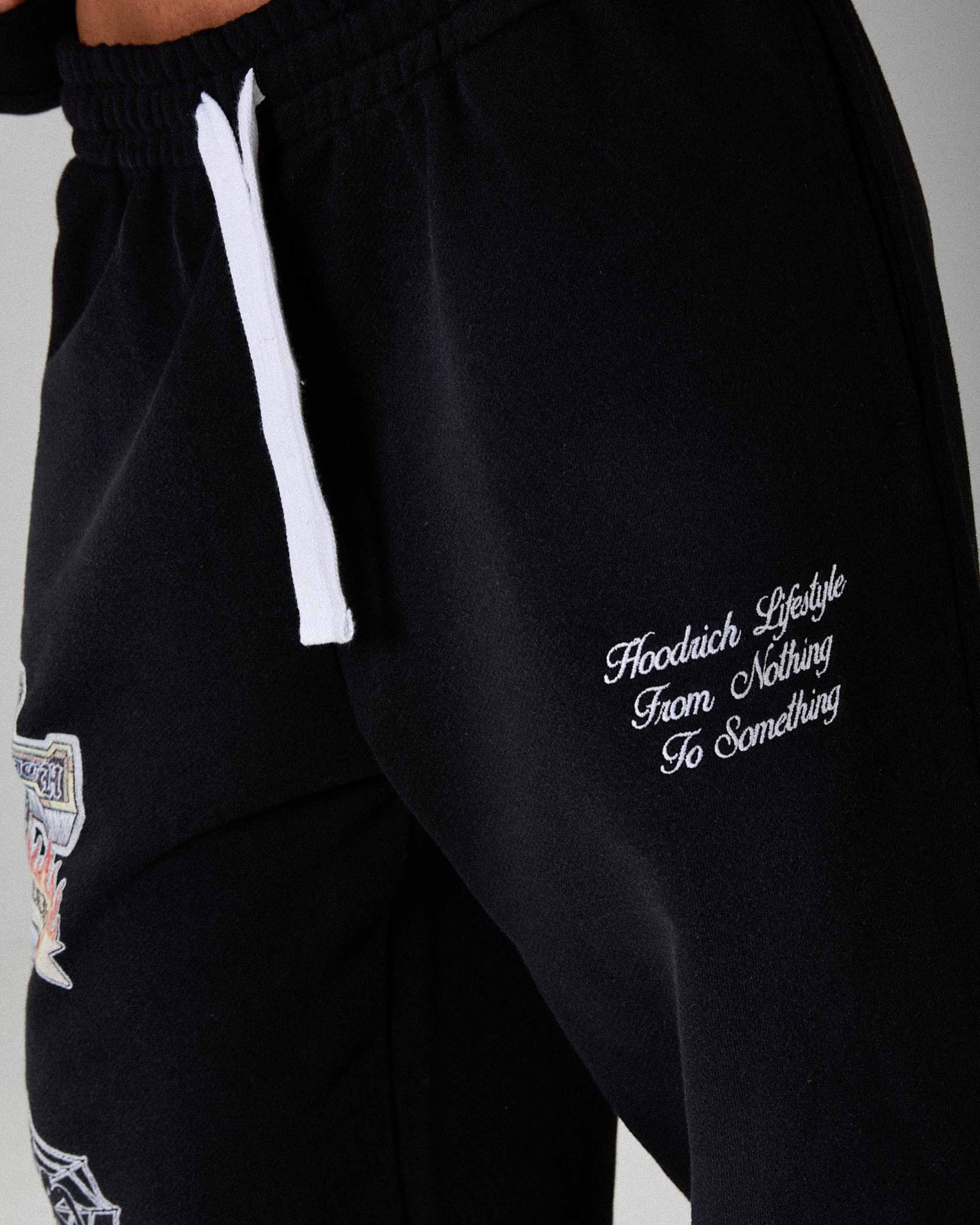 Pantaloni Jogger The Winner's Circle Phase Oversized con Orlo Aperto - Nero