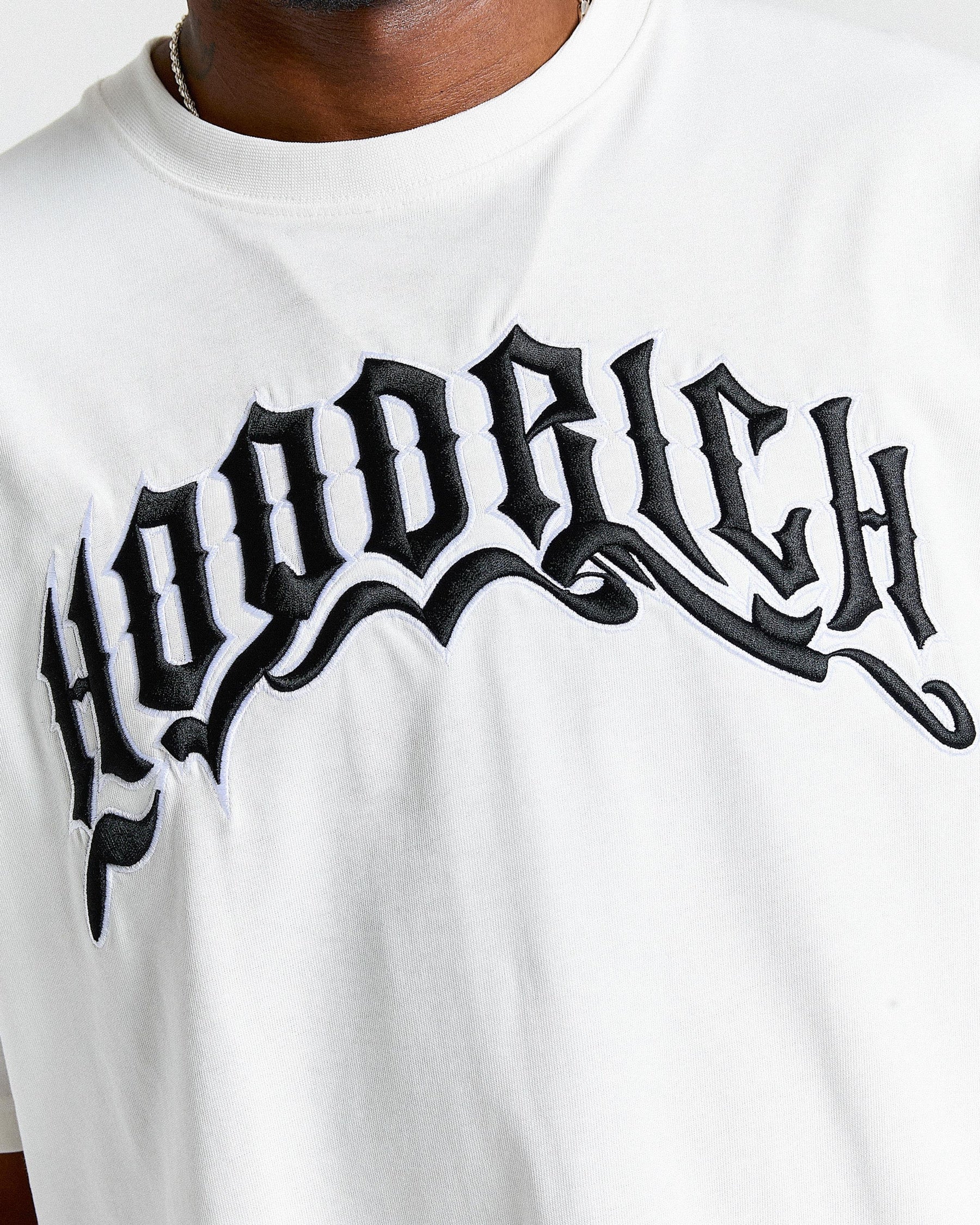 White t-shirt with 'Hoodrich' printed in black stylized text