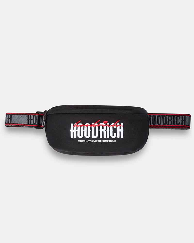 A black cross body bag with a wide, patterned black and red strap. The front features a bold white 'HOODRICH' logo with red graffiti-style lettering above it and smaller white text below reading 'FROM NOTHING TO SOMETHING'.