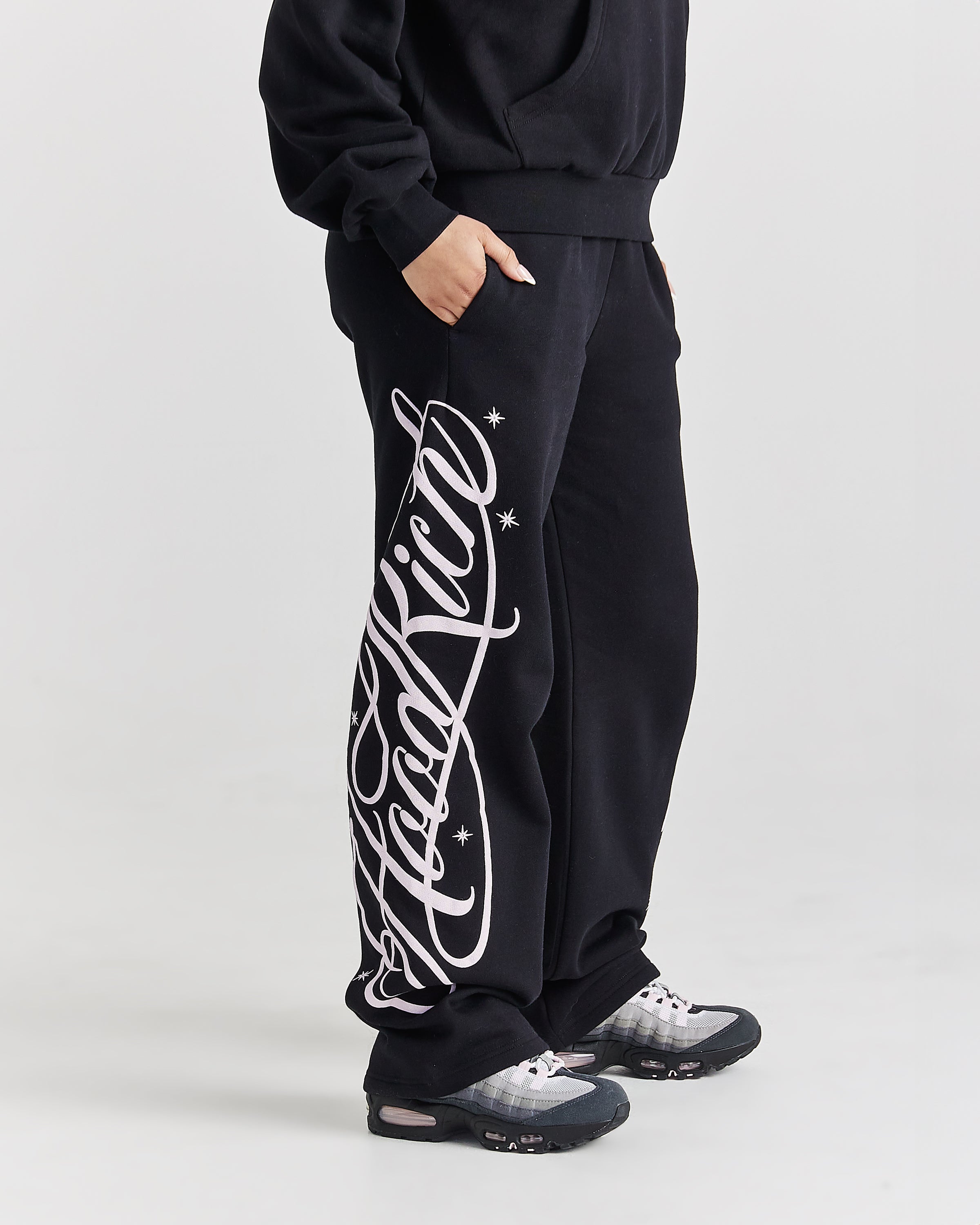 Pantaloni da jogging a gamba larga Solace - Nero/Rosa