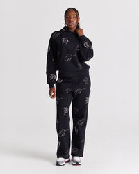 Pantaloni da jogging a gamba larga con cristalli - Nero/Strass rosa
