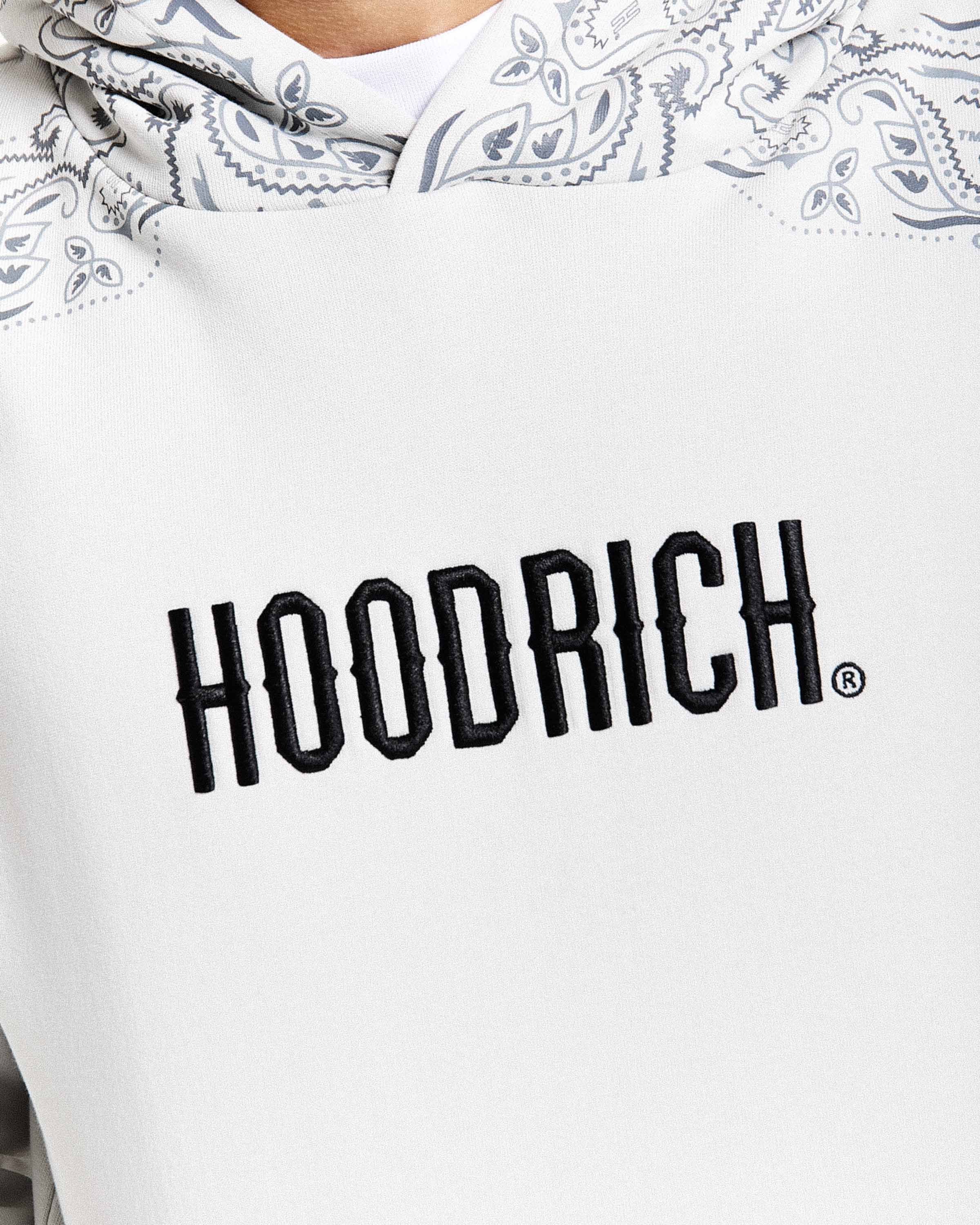 White hoodie with 'HOODRICH' logo and patterned hood