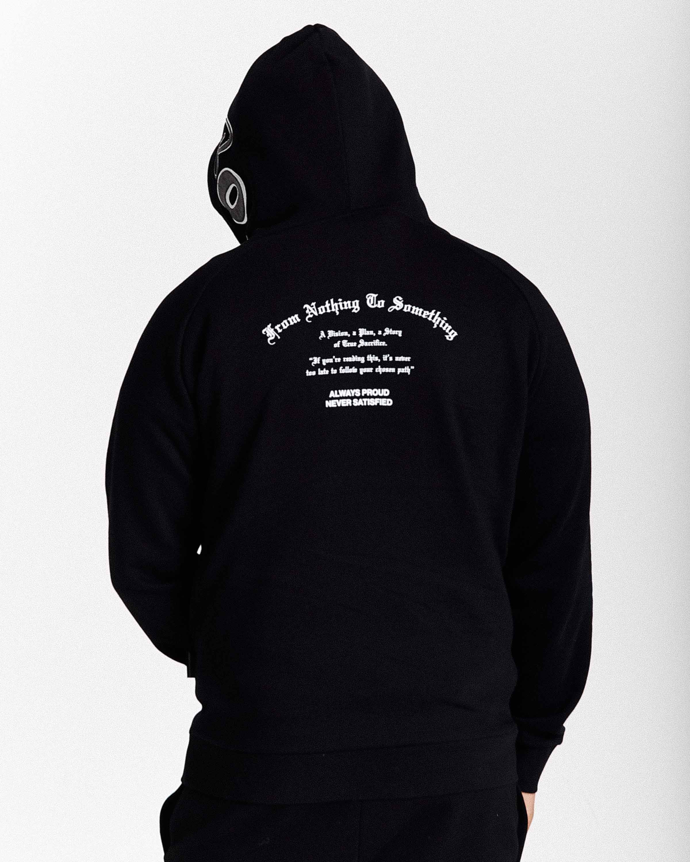 Black hoodie with white text on the back against a white background